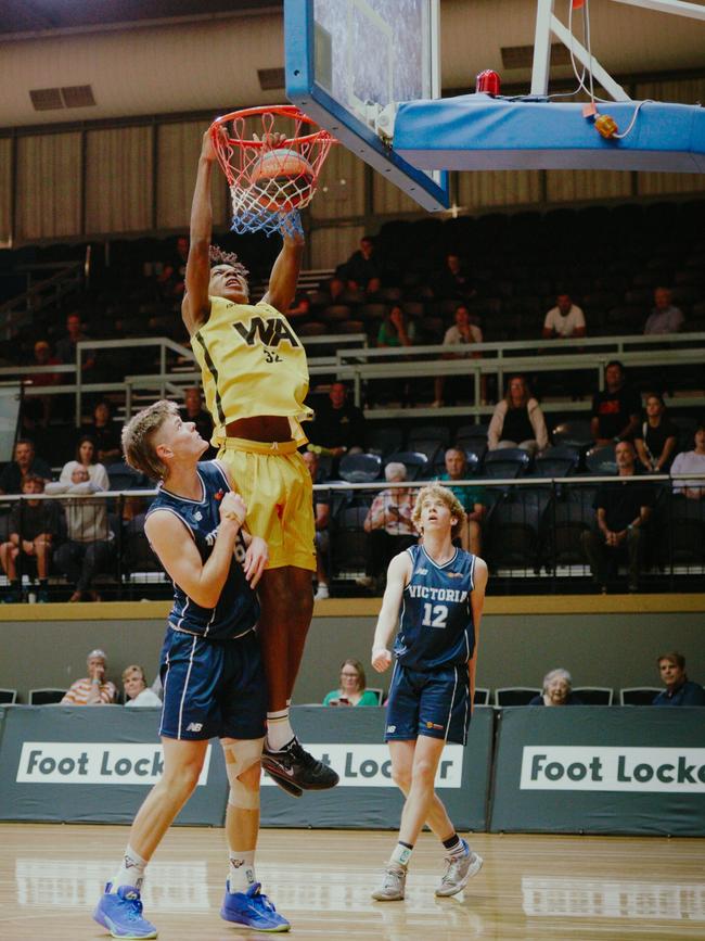 Western Australia's Josh Ibukunoluwa dunks on the competition at the Under-20 National Championships. Picture: Lara Sinclair