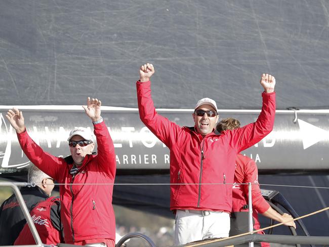Mark Richards celebrates as he crosses the finish line. Wild Oats XI skippered by Mark Richards sails up the River Derwent on her way to a 9th line honours victory in the 2018 Sydney to Hobart Yacht Race. The yacht crossed the line in 1d 19hrs 7mins 21secs . Picture: RICHARD JUPE