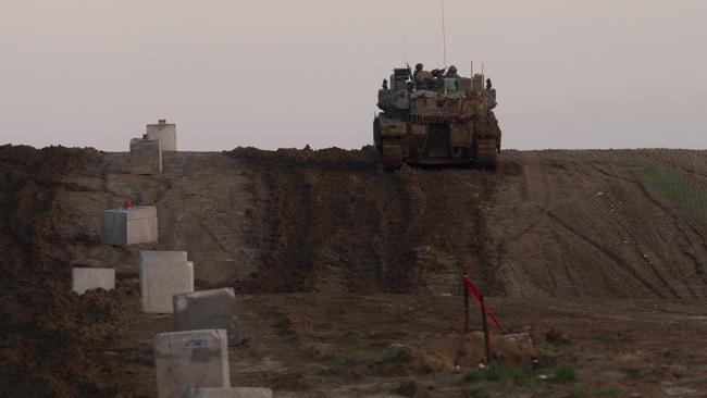 An Israeli tank moves along the border with the Gaza Strip in southern Israel on January 1. Picture: Getty Images