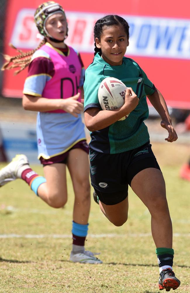 A rookie Raewyn Olomalii pictured in 2019 playing in the Under-12 girls state league titles at Burleigh juniors fields.