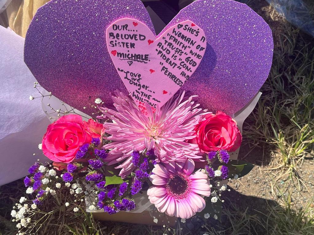 A heartfelt card dedicated to Michale Chandler sits at the crash site.