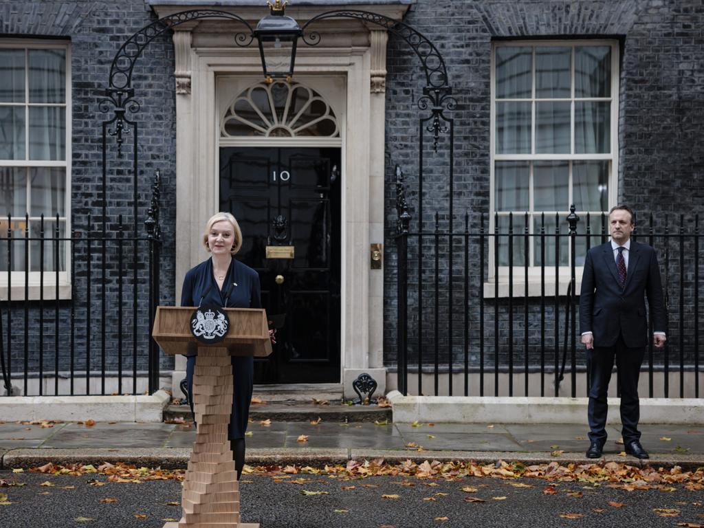 Liz Truss, flanked by her husband Hugh O'Leary, resigns as British prime minister. Picture: Getty Images