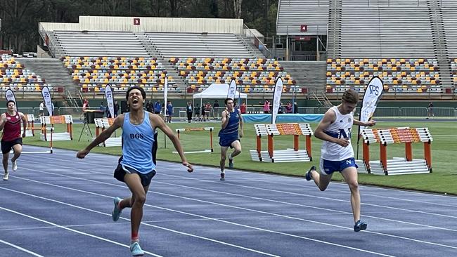 Brisbane Grammar School's Alex Thakur wins the opening event of the day, the open 400m.