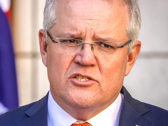 CANBERRA, AUSTRALIA - JULY 9: Australian Prime Minister Scott Morrison speaks during a media conference at Parliament House on July 9, 2020 in Canberra, Australia. Australia has suspended its extradition policy with Hong Kong in light of recent changes to security laws. Australia will also offer visas for residents of Hong Kong to apply for residency in Australia. (Photo by David Gray/Getty Images)