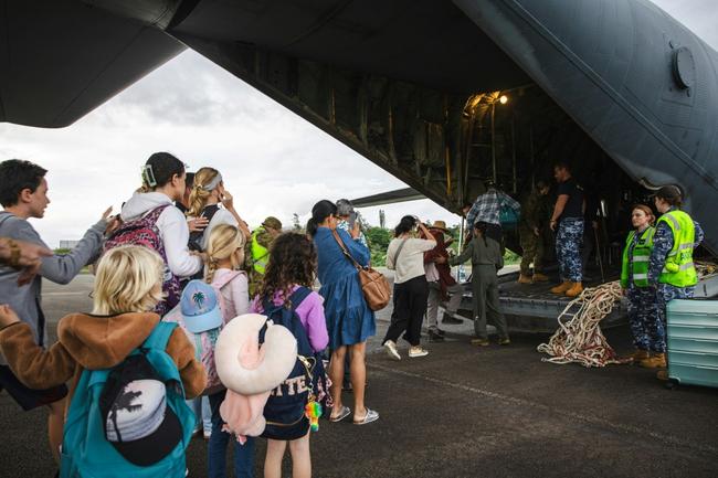 A Royal Australian Air Force C-130 Hercules aircraft evacuating people at Noumea-Magenta Airport in New Caledonia