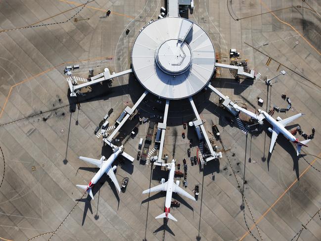 DO NOT USE BEFORE DEC 28TH, CONTACT COURIER MAIL PIC DESK Aerial images over Brisbane in summer. Qantas planes at Brisbane Domestic Airport.