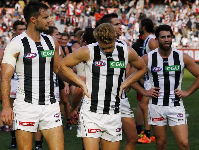 Disappointed Pies Nathan Brown, Adam Treloar and Alex Fasolo after the loss to St Kilda. Picture: Wayne Ludbey