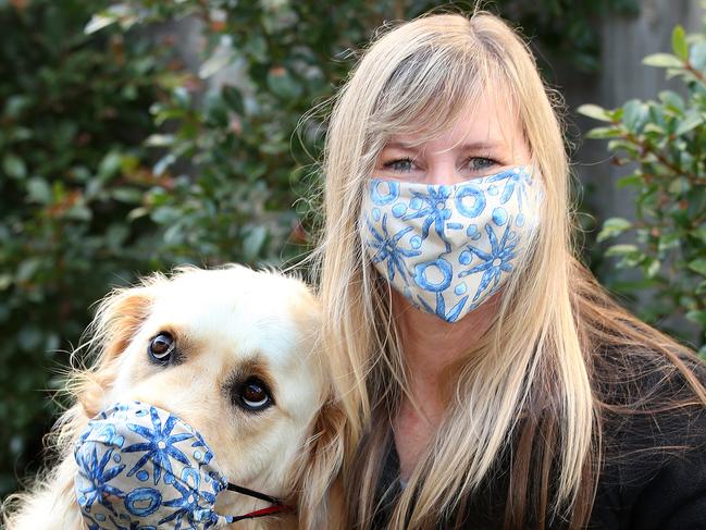 Franklin models one of  Maz Clark's  face masks made partially from wetsuit material. Picture: Alison Wynd