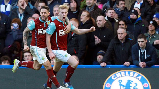 Burnley's English defender Ben Mee (R) celebrates with Danny Ings.
