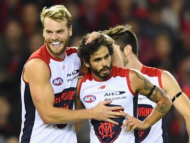 MELBOURNE, AUSTRALIA - APRIL 30:  Jeff Garlett of the Demons is congratulated by Jack Watts after kicking a goal during the round six AFL match between the Essendon Bombers and the Melbourne Demons at Etihad Stadium on April 30, 2017 in Melbourne, Australia.  (Photo by Quinn Rooney/Getty Images)