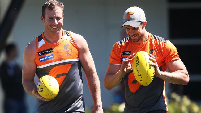 Steve Johnson and Brett Deledio walk laps during GWS Giants session. Picture: Phil Hillyard