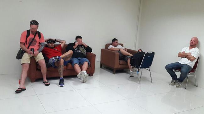 The Australian men taken off a Jetstar flight in detention at Denpasar airport in Bali.