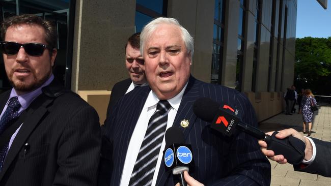Clive Palmer, flanked by security guards, at the Federal Court in Brisbane last month. Picture: AAP.