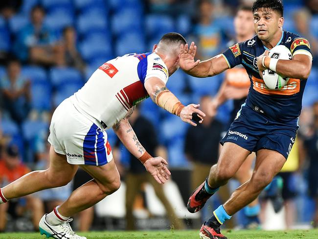 GOLD COAST, AUSTRALIA - SEPTEMBER 25: Tyrone Peachey of the Titans is tackled by Bradman Best of the Knights during the round 20 NRL match between the Gold Coast Titans and the Newcastle Knights at Cbus Super Stadium on September 25, 2020 in Gold Coast, Australia. (Photo by Matt Roberts/Getty Images)