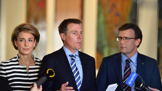 Question time: Christian Porter and Alan Tudge get backed into a corner as Minister for Employment Michaelia Cash adopts a thousand yard stare. Picture: AAP