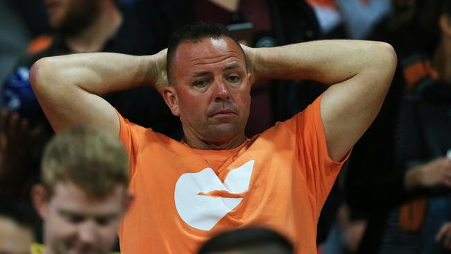 The face says it all. One of the dejected Giants fans after their loss in the AFL Preliminary Final between GWS and Western Bulldogs last year. Picture: Toby Zerna