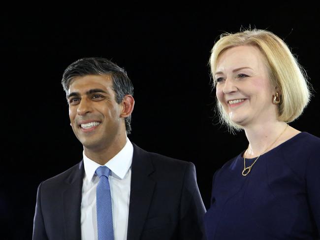 Rishi Sunak, Britain's former Chancellor of the Exchequerm (L) and Britain's Foreign Secretary Liz Truss, the final two contenders to become the country's next Prime Minister and leader of the Conservative party, stand together on stage during the final Conservative Party Hustings event at Wembley Arena, in London, on August 31, 2022. (Photo by Susannah Ireland / AFP)