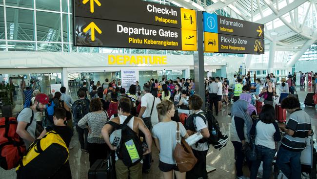 Travellers at Ngurah rai Airport in Denpasar, Bali. Picture: Agung Parameswara/Getty Images