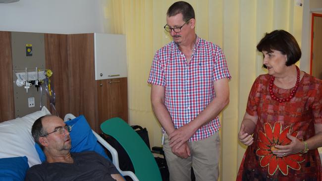 Truck driver Bruce Shenfield, who is recovering from multiple injuries after a car crash, talks to Orthopedics Director Dr Jonathan Smith and Mackay MP Julieanne Gilbert about his treatment in the new orthopedic ward at Mackay Base Hospital.