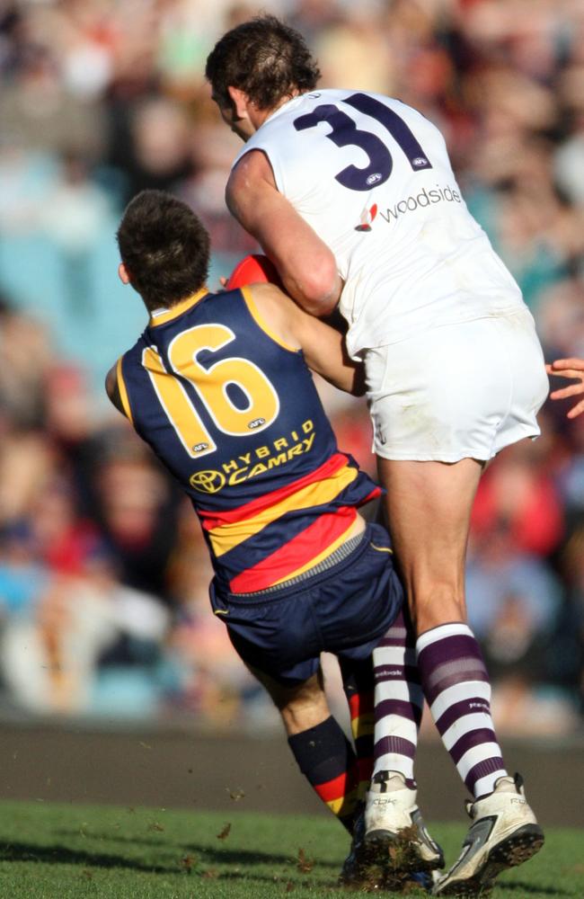 Fremantle ruckman Aaron Sandilands crunches Adelaide defender Phil Davis in 2010.