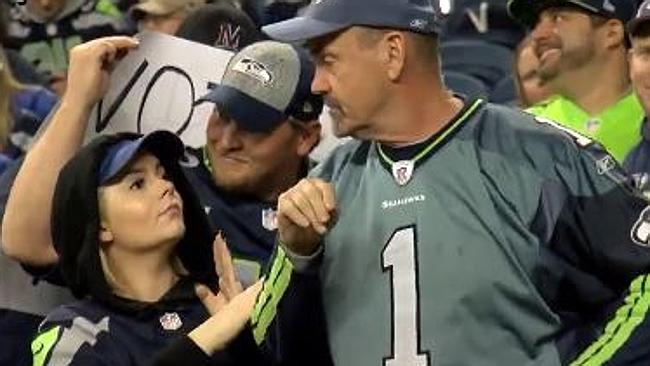 A Seahawks fan slaps a sexist heckler.