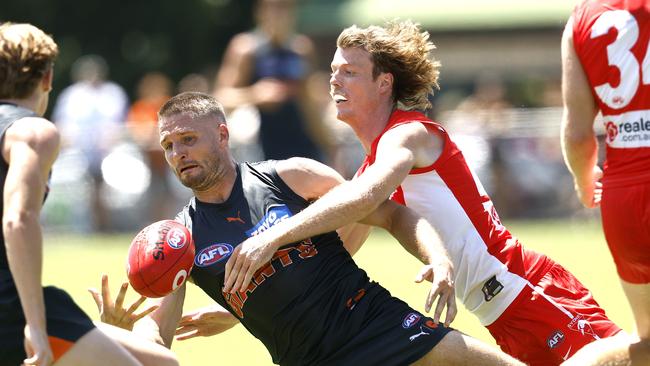 Giants Jesse Hogan tackled by Sydney's Nick Blakey at Tramway Oval on Saturday. Picture: Phil Hillyard