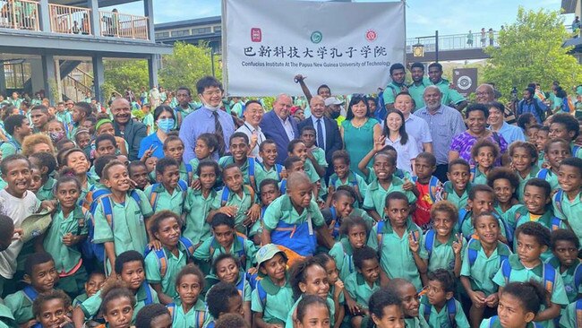 The students and guests at the launch of a Confucius classroom in the Butuka Academy in October 2021. Picture: Xinhua