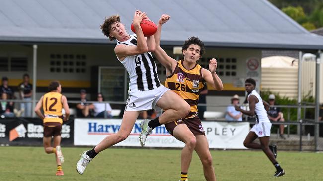 Sherwood’s Jackson Bridge marks ahead of Thomas Steel in last Saturday’s two point thriller against Aspley. Picture, John Gass