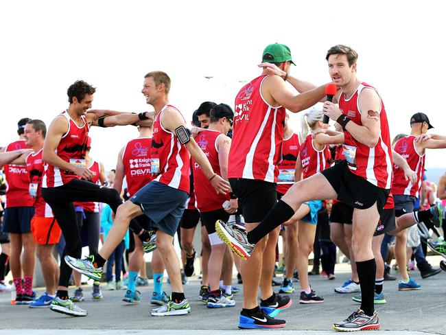 2014 Point to Pinnacle. members of the Tash Dash team take competitors through some warm up moves