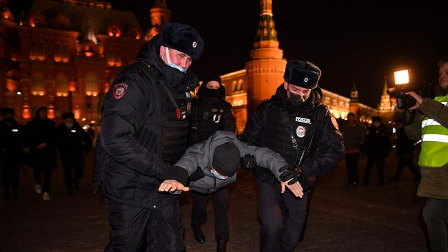 Police officers detain a man during a protest against Russia's invasion of Ukraine in central Moscow. Picture: AFP.