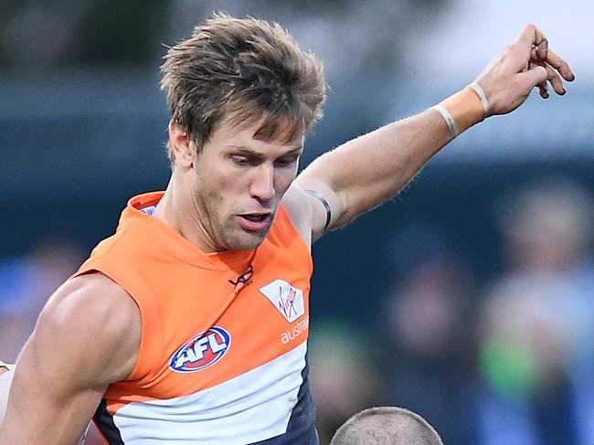 HOBART, AUSTRALIA - JUNE 16: Ben Cunnington of the Kangaroos smouthers a kick by Matt De Boer of the Giants during the round 13 AFL match between the North Melbourne Kangaroos and the Greater Western Sydney GIants at Blundstone Arena on June 16, 2019 in Hobart, Australia. (Photo by Quinn Rooney/Getty Images)