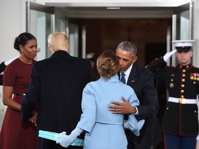 US President Barack Obama and First Lady Michelle Obama welcome incoming President Donald Trumpand his wife Melania to the White House in Washington, DC on January 20, 2017. Picture: AFP