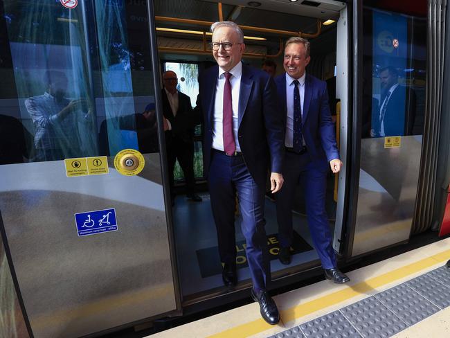 Premier Steven Miles and Prime Minister Anthony Albanese step off a tram on the Gold Coast. Picture: Adam Head.