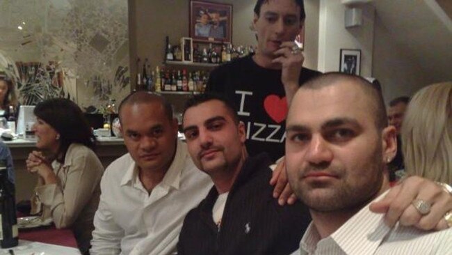 Slain Comanchero bikie Mick Hawi (middle, wearing a black jacket). Picture: Network News