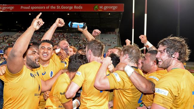 Brisbane City players celebrate their NRC grand final victory.