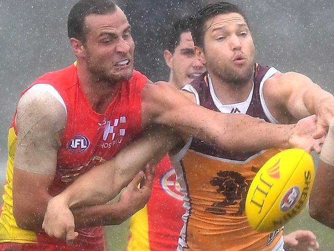 BRISBANE, AUSTRALIA - MARCH 11:  Stefan Martin of the Lions and Jarrod Witts of the Suns challenge for the ball during the JLT Community Series AFL match between the Gold Coast Suns and the Brisbane Lions at Fankhauser Reserve on March 11, 2018 in Brisbane, Australia.  (Photo by Bradley Kanaris/Getty Images)