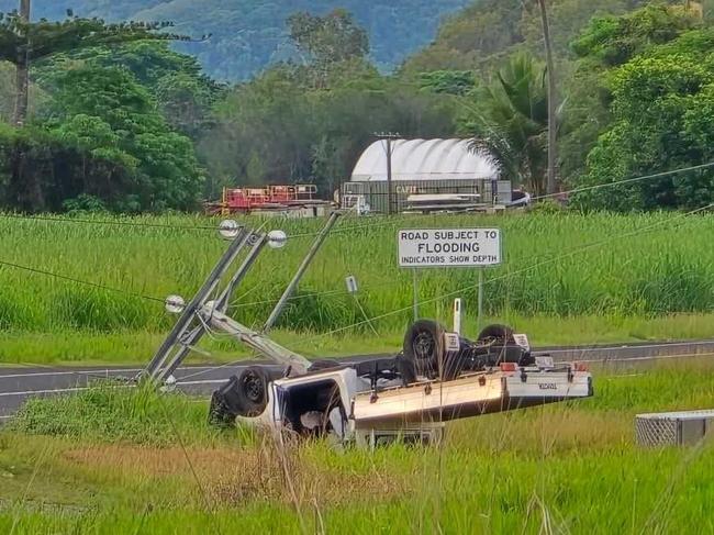 Thousands are without power and one man has been transported to hospital after a ute left the road hitting a power pole and rolling onto its roof in Yorkeys Knob. Photo: Facebook.