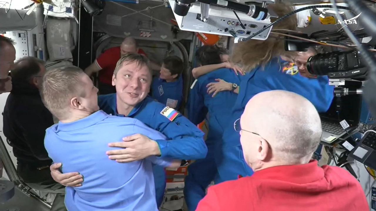 SpaceX Dragon Crew-10 member Roscosmos cosmonaut Kirill Peskov greets members of the International Space Station crew. Picture: NASA/AFP