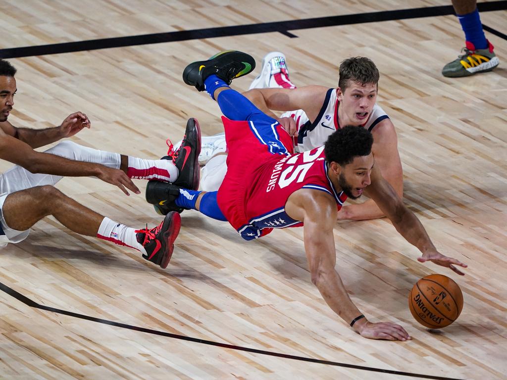 Ben Simmons dives for a loose ball. (Photo by Ashley Landis-Pool/Getty Images)