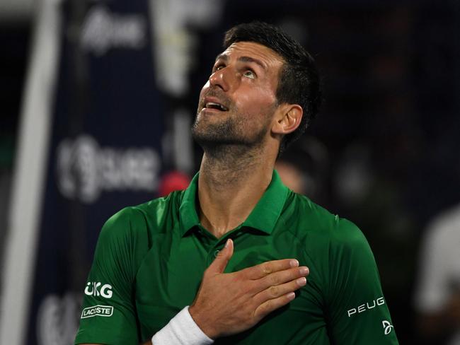 DUBAI, UNITED ARAB EMIRATES - FEBRUARY 23: Novak Djokovic of Serbia reacts after beating Karen Khachanov of Russia in the second round match during day 10 of the Dubai Duty Free Tennis at Dubai Duty Free Tennis Stadium on February 23, 2022 in Dubai, United Arab Emirates. (Photo by Martin Dokoupil/Getty Images)