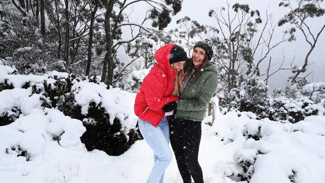 Friends from Hobart Brooke Rogers and Milly Russell near Lake Dobson at Mount Field.  Lots of snow with more on the way.  Picture: NIKKI DAVIS-JONES