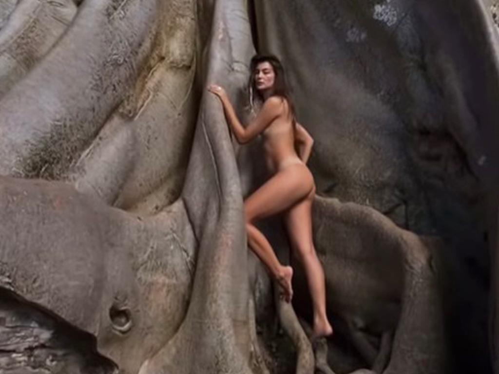 Alina posing naked on an ancient tree considered sacred in Bali, in May, 2022. (Newsflash) Picture: Newsflash/Australscope