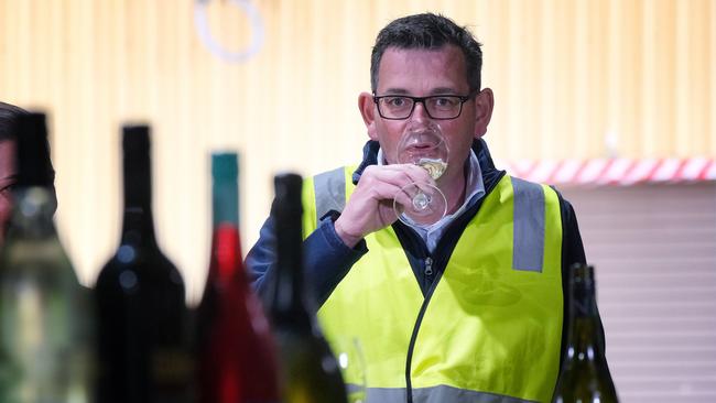 Daniel Andrews samples the wares at the Brown Brothers winery in Milawa, southeast of Wangaratta, on Monday. Picture: AAP