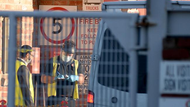 Visitors, contractors and staff have their temperatures taken at Cedar Meats, one of the abattoirs that is part of recent COVID-19 clusters. Picture: Andrew Henshaw