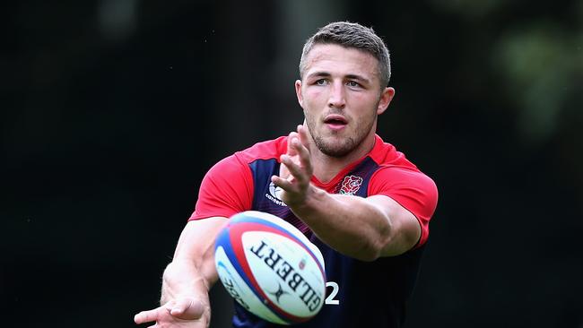 BAGSHOT, ENGLAND - SEPTEMBER 03: Sam Burgess passes the ball during the England training session held at Pennyhill Park on September 3, 2015 in Bagshot, England. (Photo by David Rogers/Getty Images)