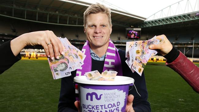 Nick Riewoldt with a collection bucket that will be at the game. Picture: Michael Klein