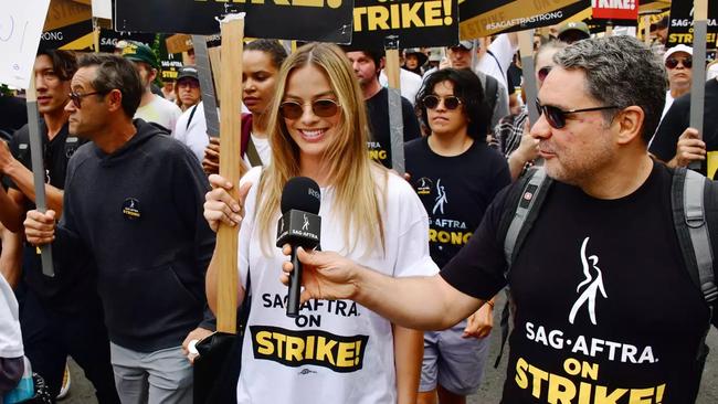 Margot Robbie on the SAG-AFTRA picket line. Picture: Splash/Shuttershock