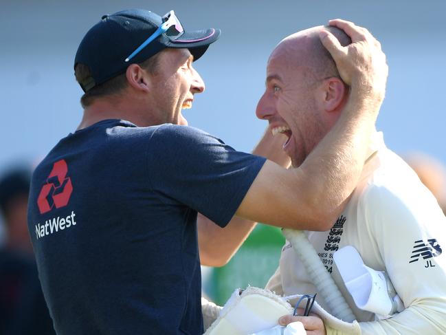 LEEDS, ENGLAND - AUGUST 25: England batsman Jack Leach celebrates with Jos Buttler (l) after day four of the 3rd Ashes Test Match between England and Australia at Headingley on August 25, 2019 in Leeds, England. (Photo by Stu Forster/Getty Images)