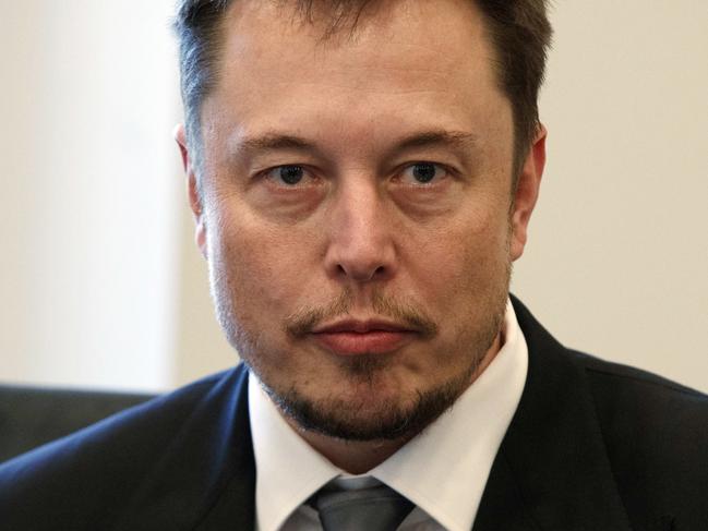 FILE - In this Dec. 14, 2016, file photo, Tesla CEO Elon Musk listens as President-elect Donald Trump speaks during a meeting with technology industry leaders at Trump Tower in New York. Musk has apologized for calling a British diver involved in the Thailand cave rescue a pedophile. In a series of tweets late Tuesday, the Tesla CEO said he had "spoken in anger" on Sunday after diver Vern Unsworth accused Musk of orchestrating a "PR stunt" by sending a small submarine to help divers rescue the soccer players and their coach from a cave. (AP Photo/Evan Vucci, File)