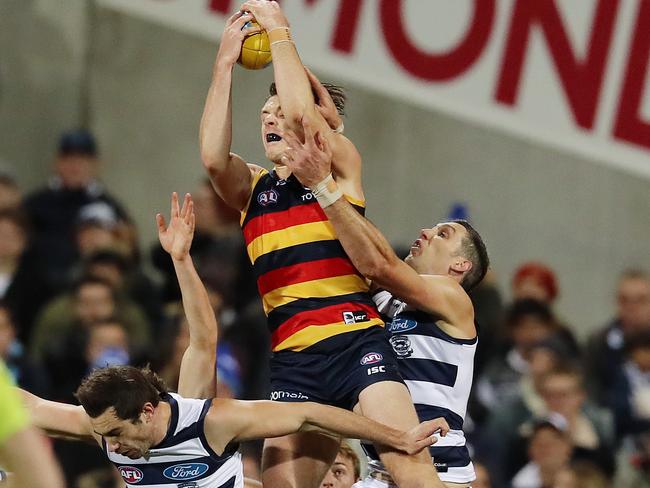 Jake Lever takes a big mark over Daniel Menzel and Harry Taylor. Picture: Michael Klein